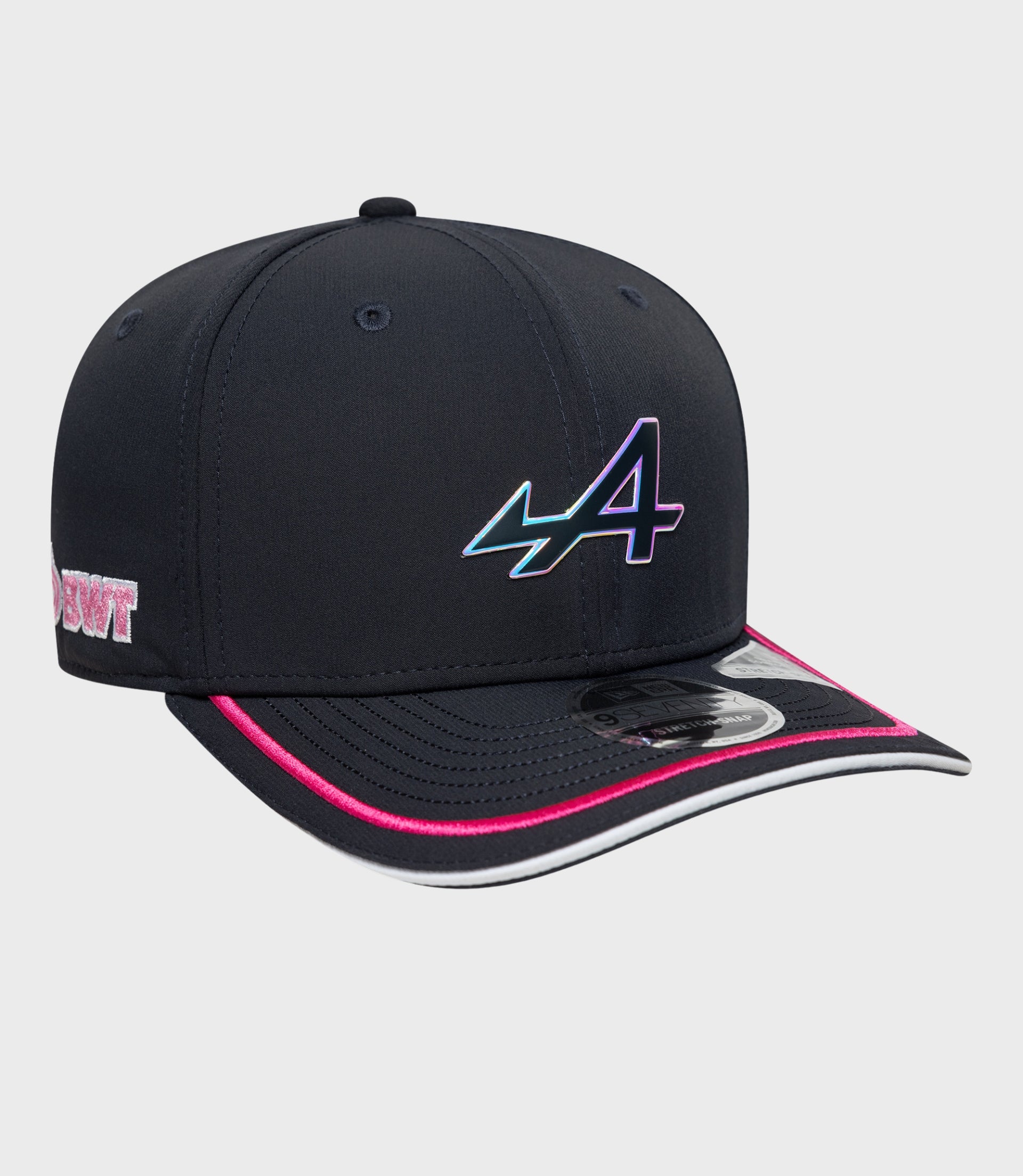Angled front view of navy cap highlighting the gradient logo and pink brim trim