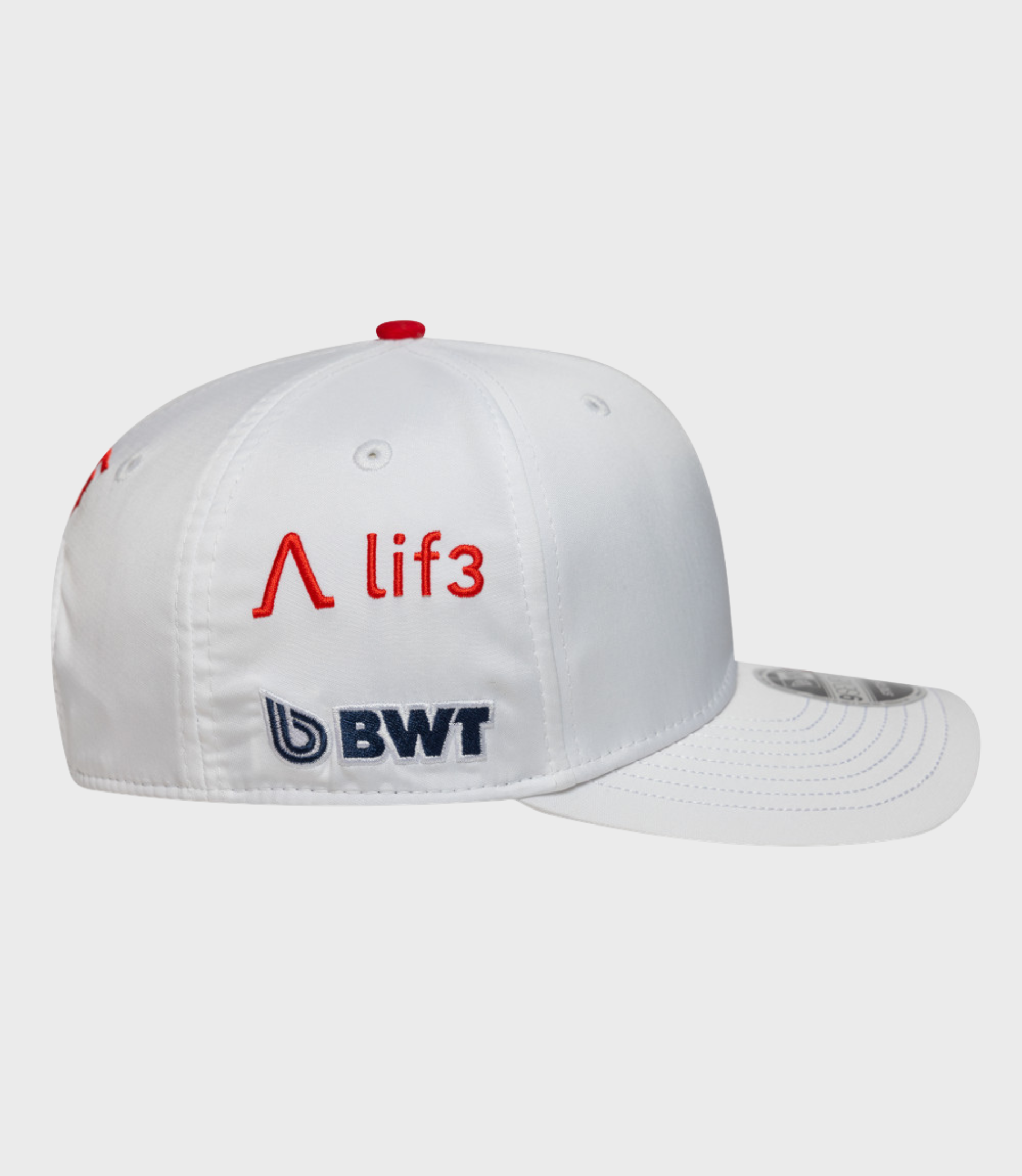 Front-left view of white Alpine Pierre Gasly Japan 9Seventy stretch snap cap with a red crown button.