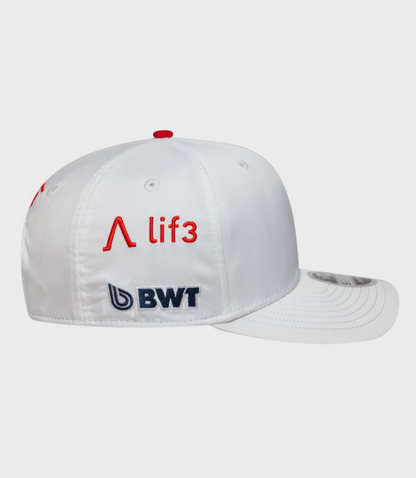 Front-left view of white Alpine Pierre Gasly Japan 9Seventy stretch snap cap with a red crown button.