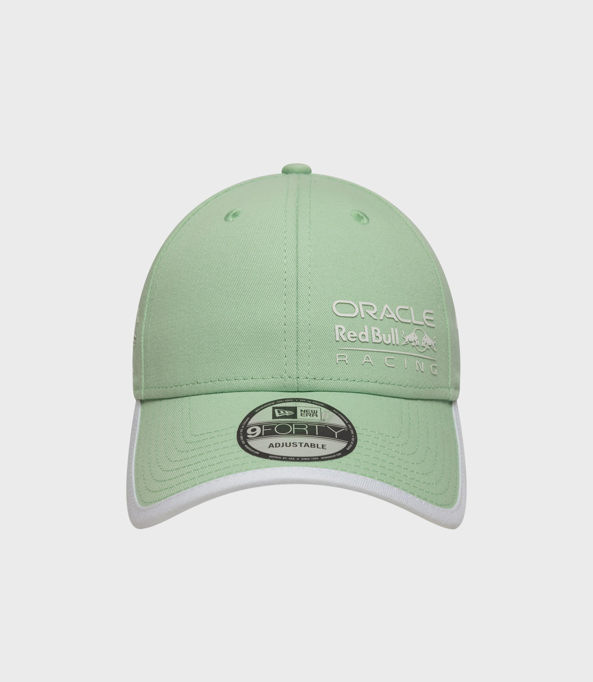 Close up of pastel green crown with top button on the Oracle Red Bull Racing Miami 9Forty cap