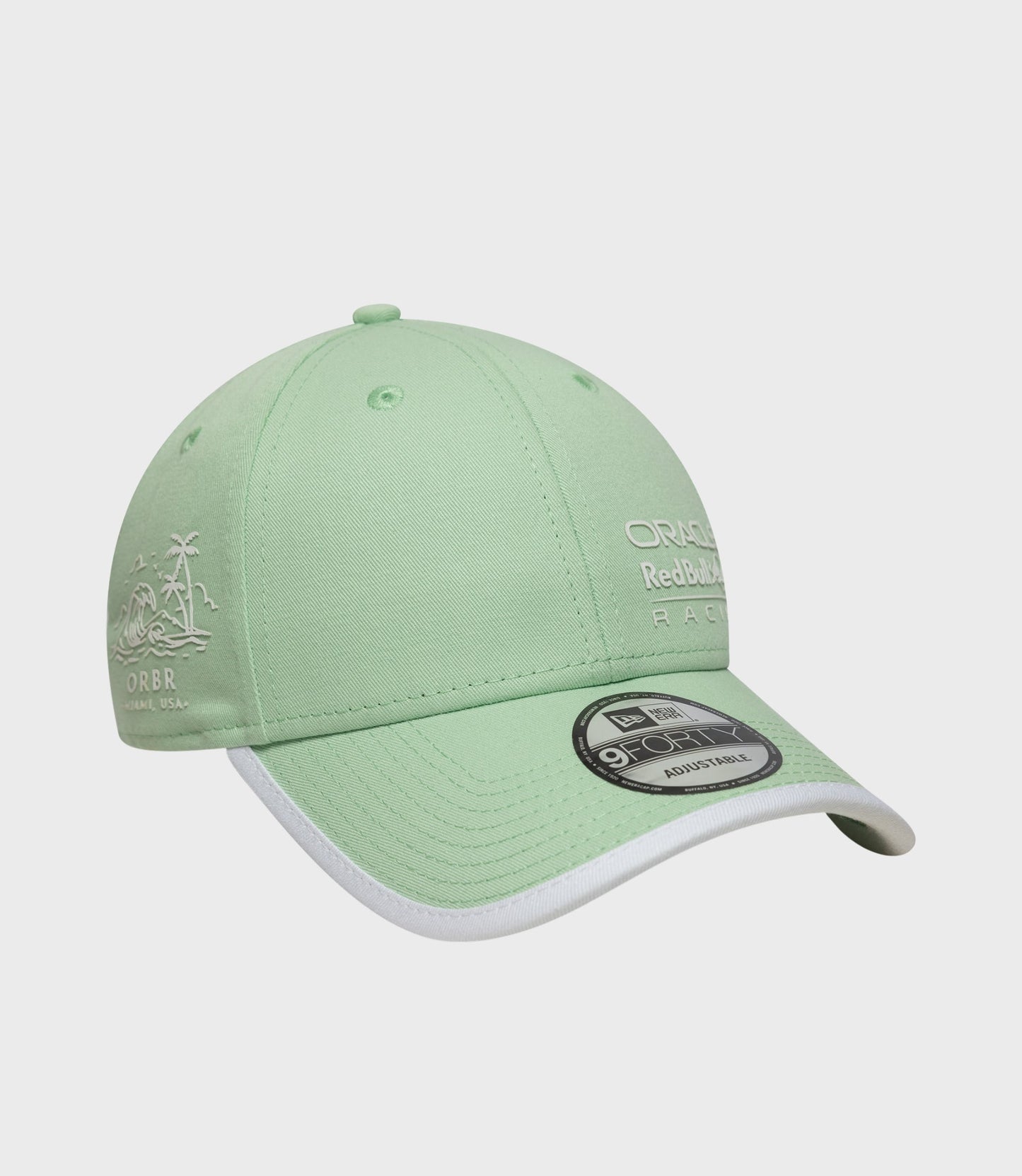 Pastel green cap side featuring palm tree embroidery and 9Forty adjustable sticker on the brim