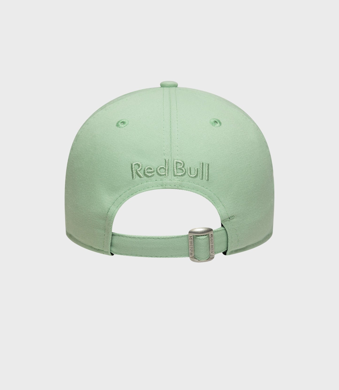 Top view of pastel green cap with crown button and ventilation eyelets