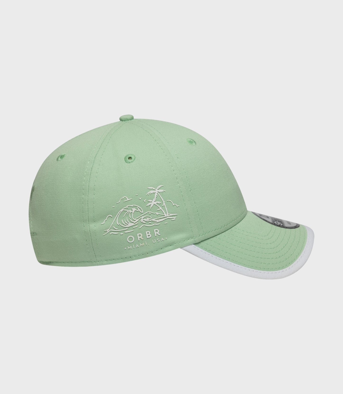 Pastel green New Era 9Forty cap from Oracle Red Bull Racing Miami collection partially shown with curved brim