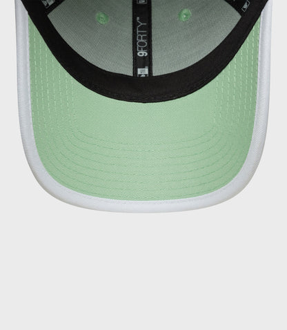Back view of pastel green cap showing adjustable strap and metal buckle