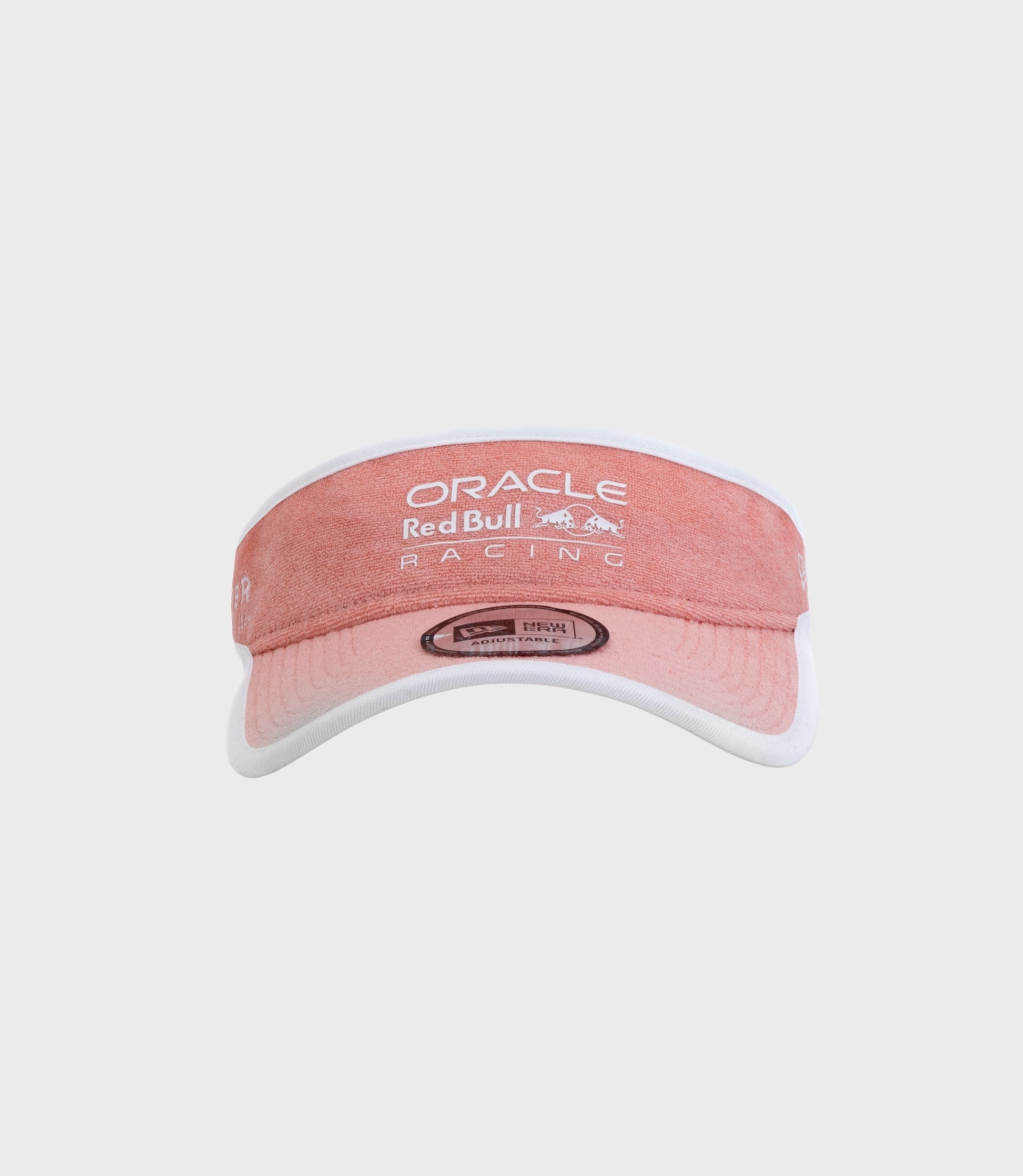 Pastel pink New Era visor cap showing Oracle Red Bull Racing branding on curved brim
