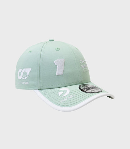 Pastel green cap displaying AlphaTauri and Oracle Red Bull Racing logos with a white trimmed brim