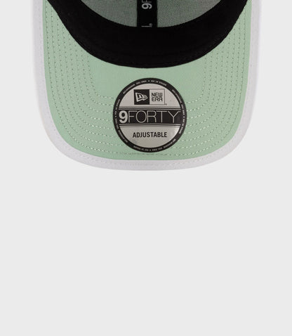 Back view of pastel green New Era 9Forty cap with adjustable strap buckle and Red Bull embroidery