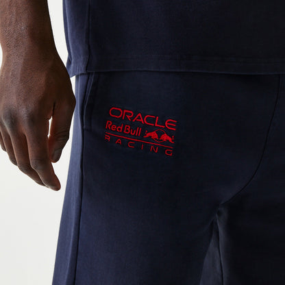 Dark blue joggers with Oracle Red Bull Racing logo on the right leg, Forever REBL wordmark on the back right, and New Era flag on the left pocket.