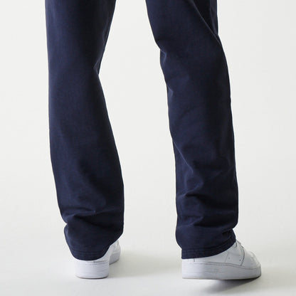 Dark blue New Era Oracle Red Bull Racing joggers worn by a model, back view.