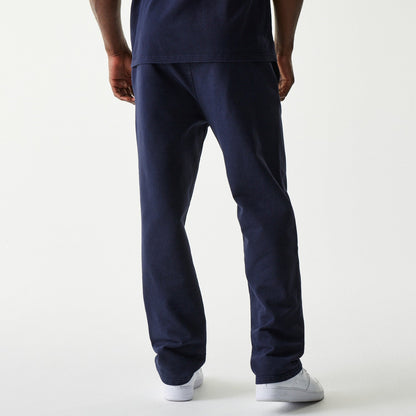 Navy Oracle Red Bull Racing joggers with New Era Flag left pocket and subtle branding, paired with white sneakers