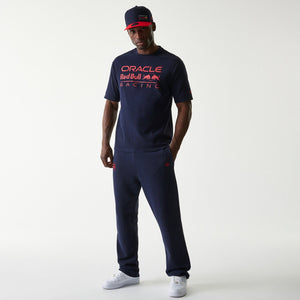 Model wearing navy joggers from the Oracle Red Bull Racing line with the Oracle logo on the right leg Forever REBL wordmark on the rear right and New Era Flag on the left pocket