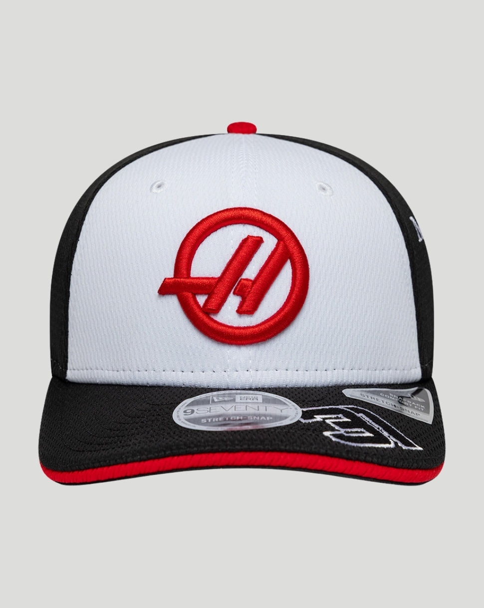 Front view of the cap with white front panel, black back, and red Haas logo.