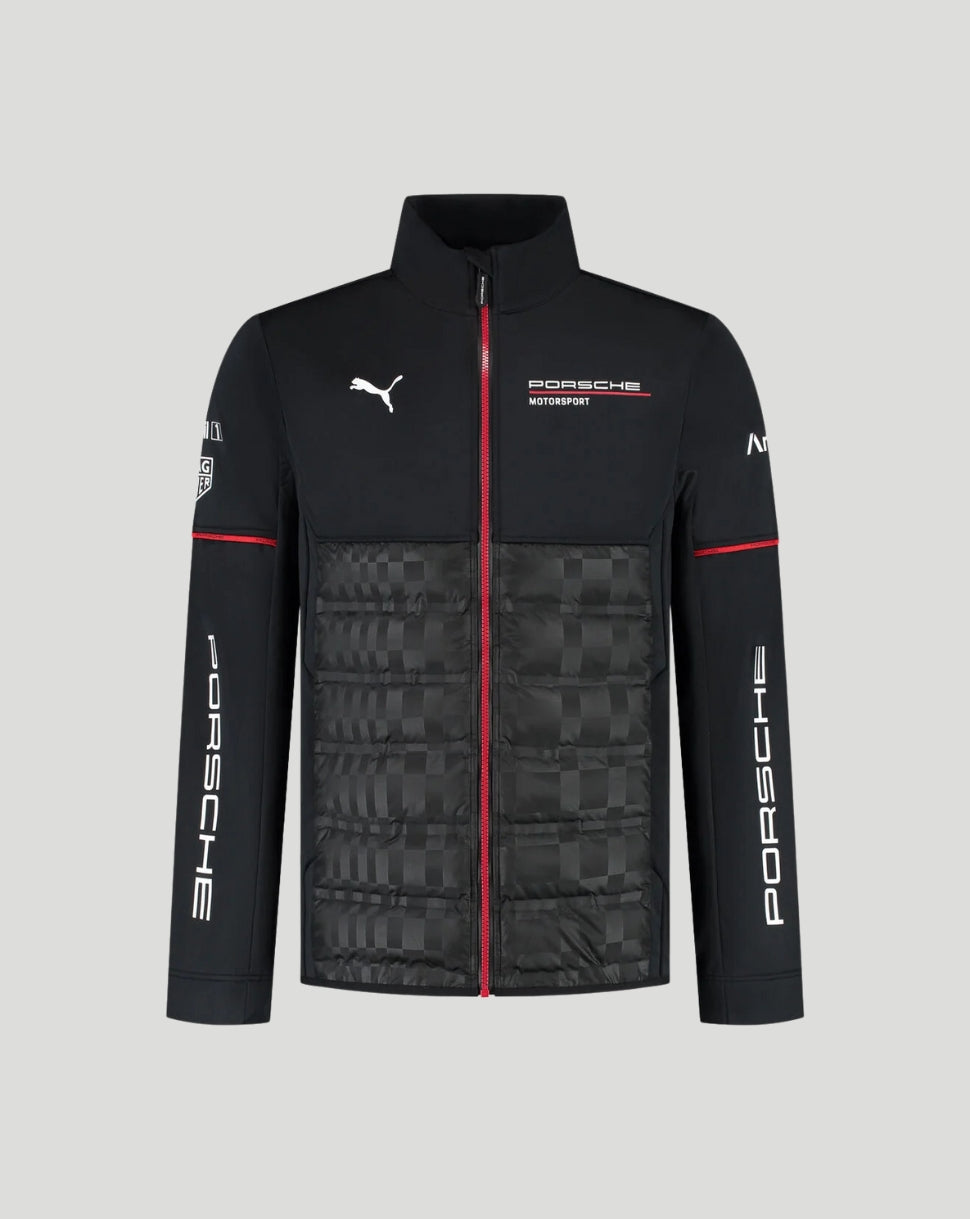 A black Puma x Porsche Motorsport zip-up jacket with a quilted lower panel, featuring white logos, a red center zipper, and red sleeve stripes, shown on a solid gray background.