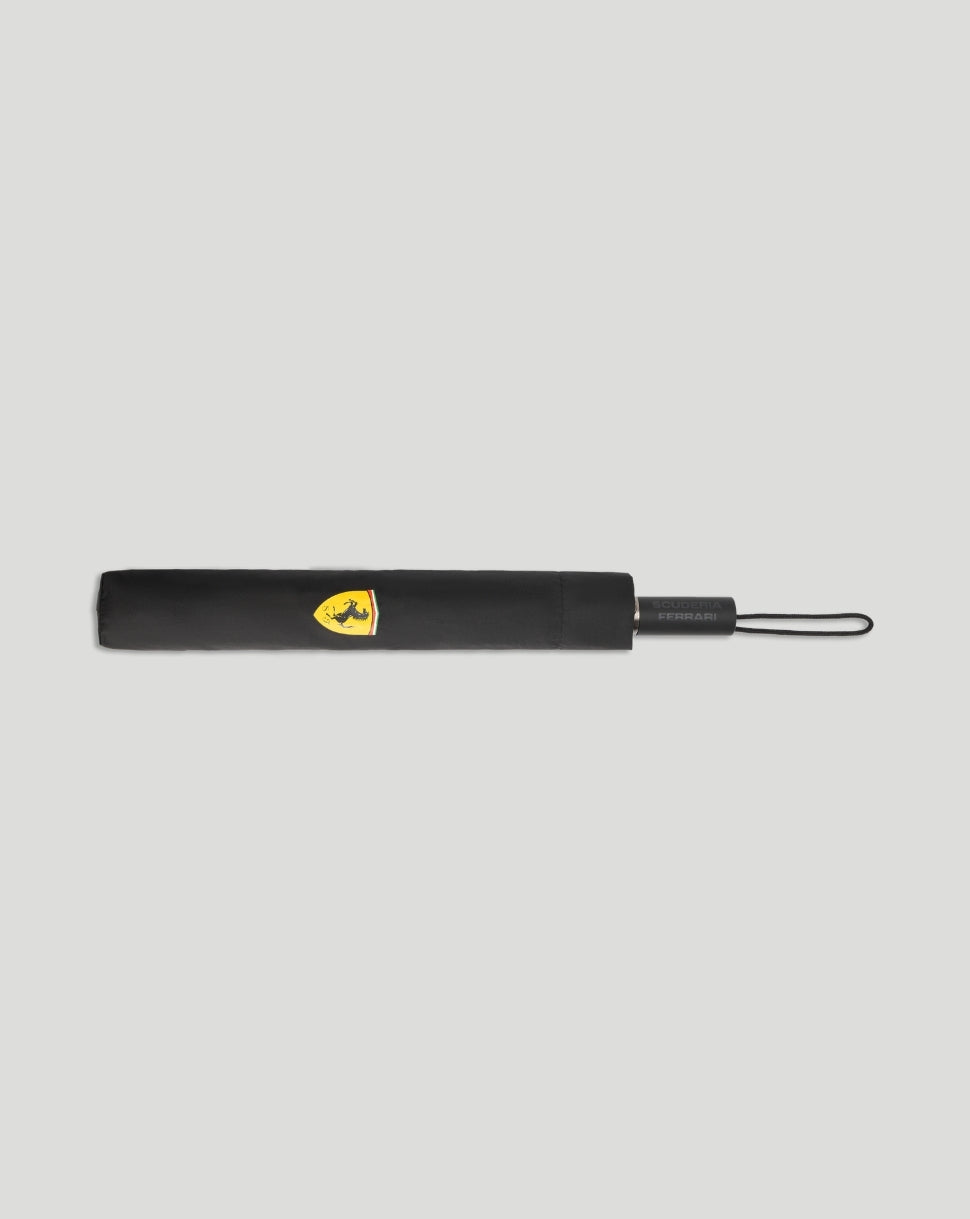 Scuderia Ferrari compact umbrella folded with the yellow crest on black fabric