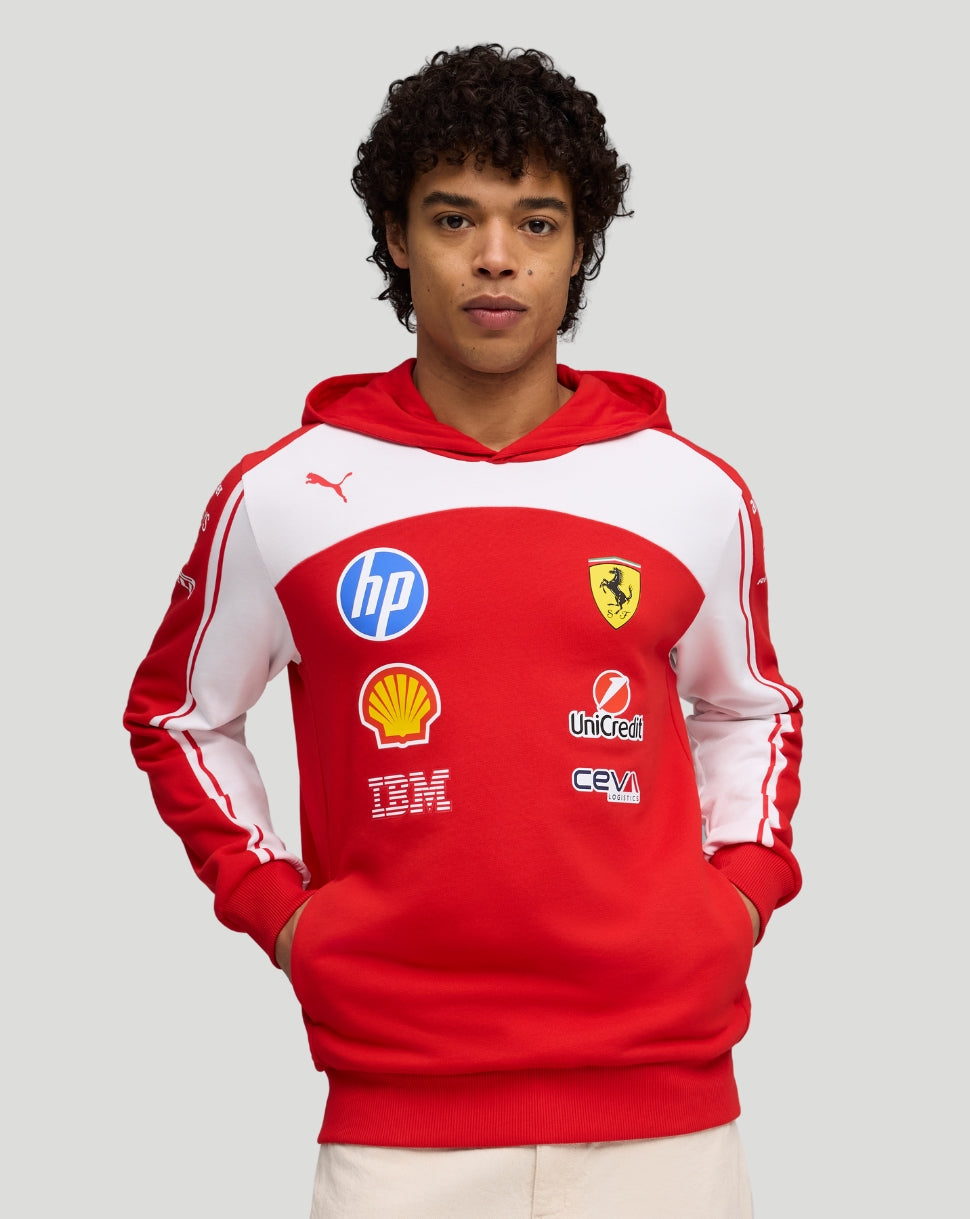 Red Scuderia Ferrari team hoodie worn by model with Scudetto crest and sponsor logos on the chest.