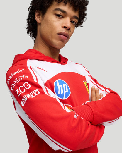 Model wearing Scuderia Ferrari hoodie in Rosso Scuderia red with white panels and sponsor logos on chest