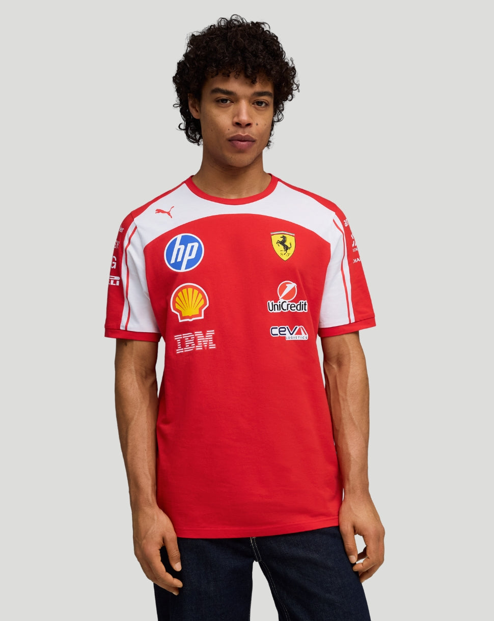 Male model wearing a red Scuderia Ferrari team T shirt with white shoulder panels and sponsor logos