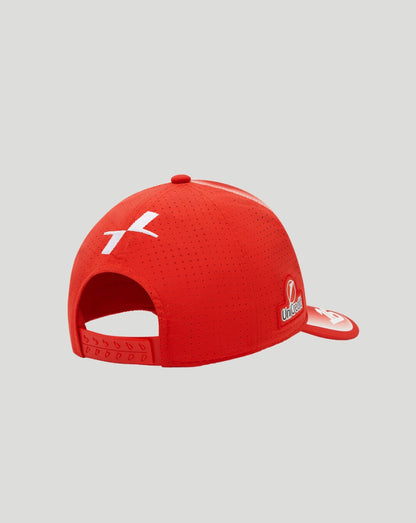 Rear view of a red perforated cap with an adjustable snap strap
