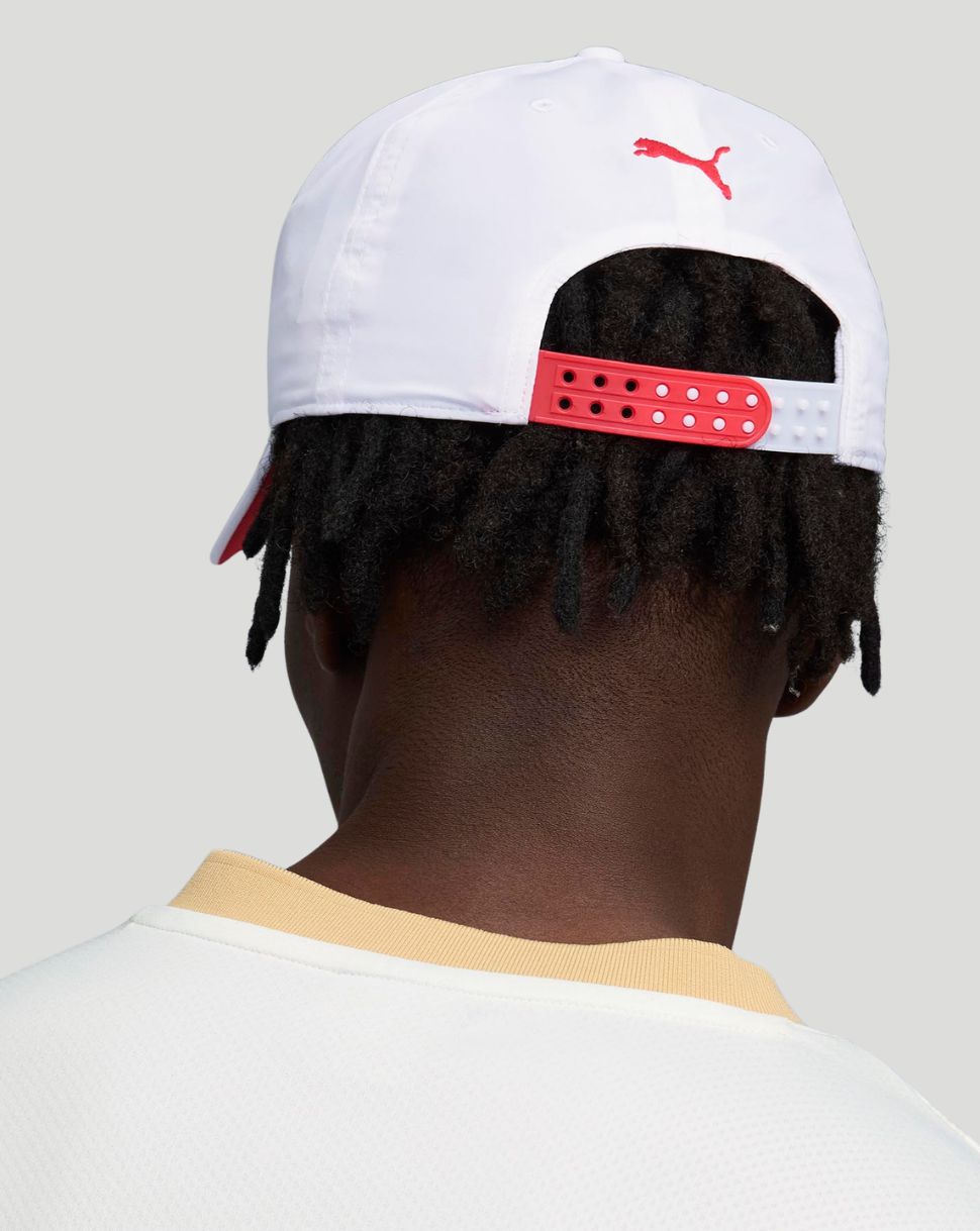 Back view of white F1 cap with a red adjustable strap.