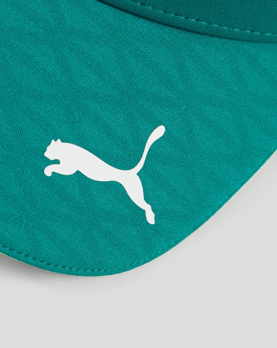Close-up of green cap fabric with white Puma logo