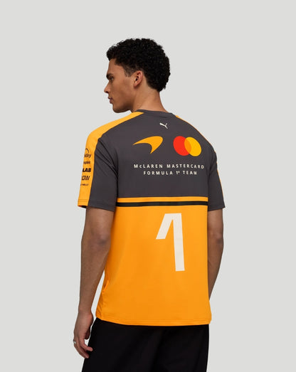 Back view of a model wearing Papaya McLaren Team Norris T-Shirt showing a large white number on the orange panel and back logos