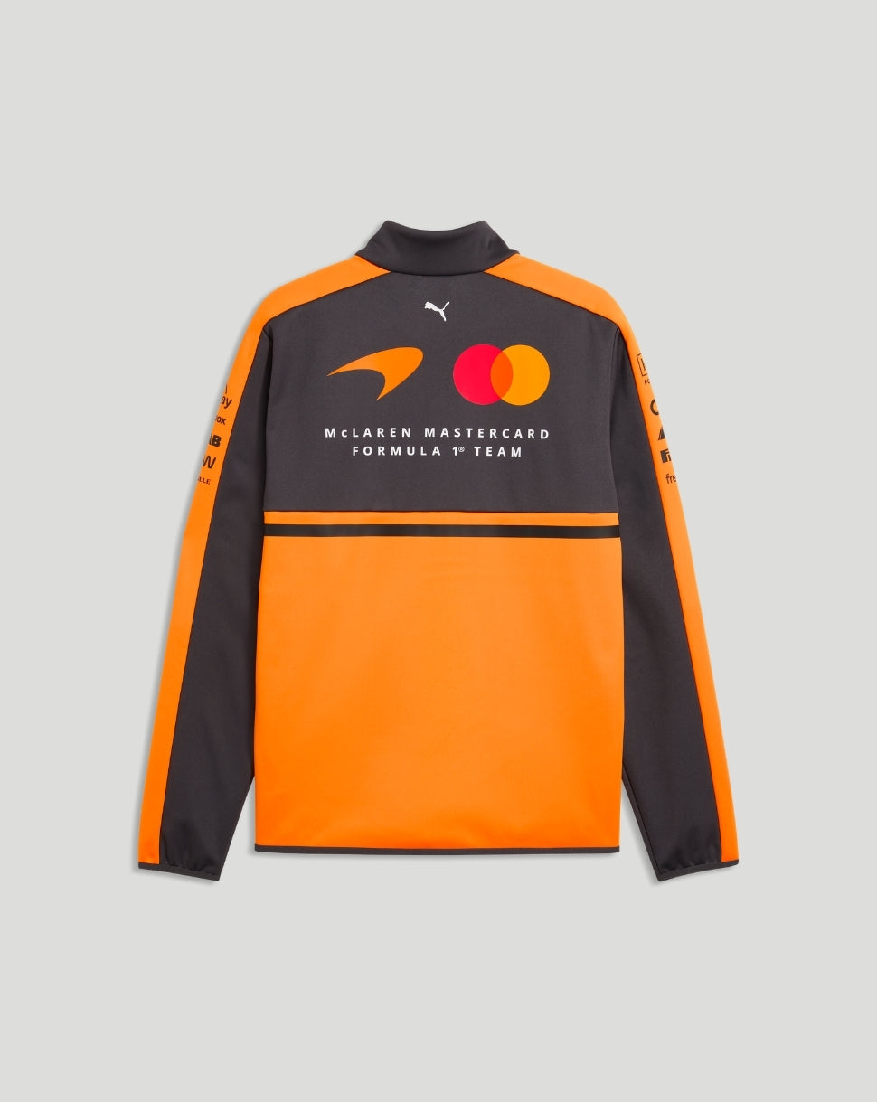 Back view of McLaren Team Softshell Jacket in Papaya orange and dark gray displaying the McLaren Mastercard Formula 1 Team logo.