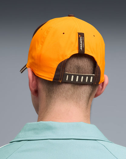 Rear view of McLaren Papaya cap showing adjustable strap and back tag