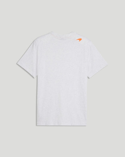 Back view of a white McLaren T Shirt with a small orange logo at the upper back near the shoulder.