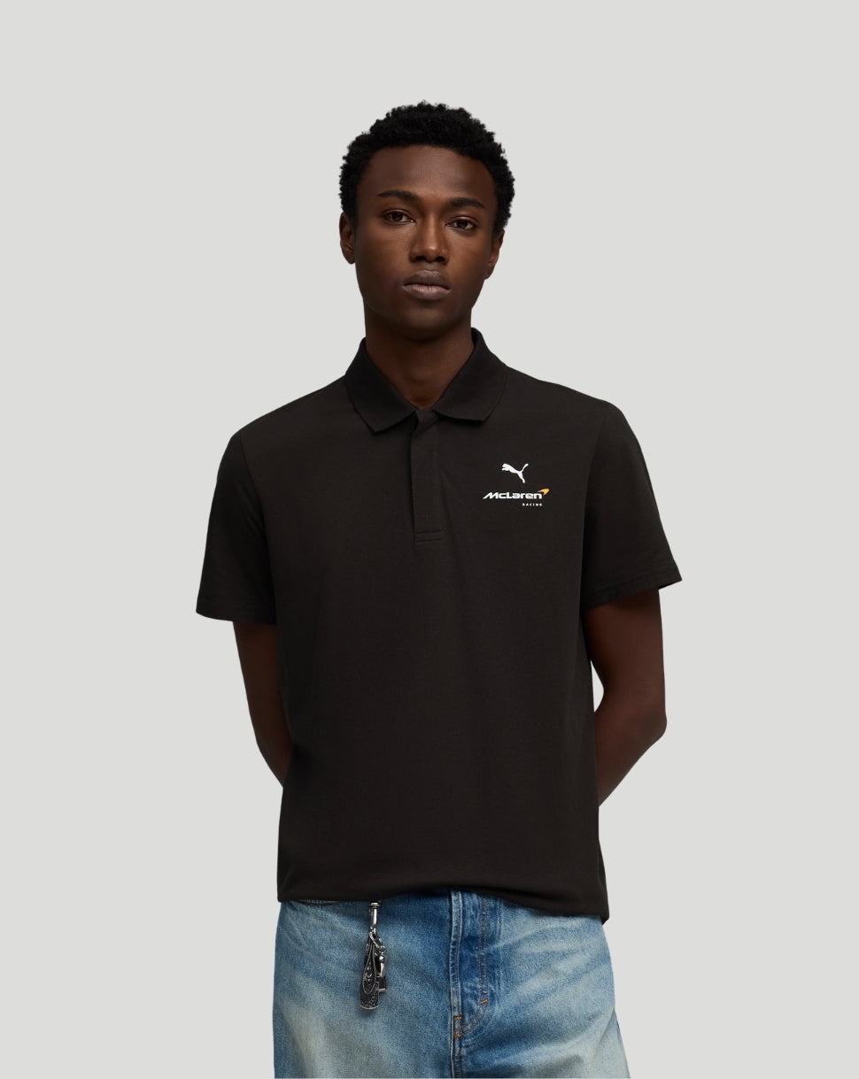 Male model wearing black McLaren polo with small white logo on the left chest.