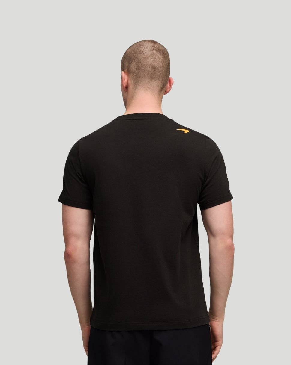 Back view of black McLaren Piastri Core T-Shirt with a small orange Puma logo on the shoulder.
