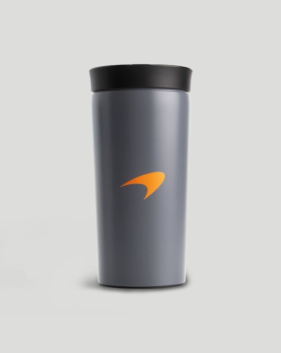 Grey McLaren thermal mug with black lid and bright orange logo on the side.