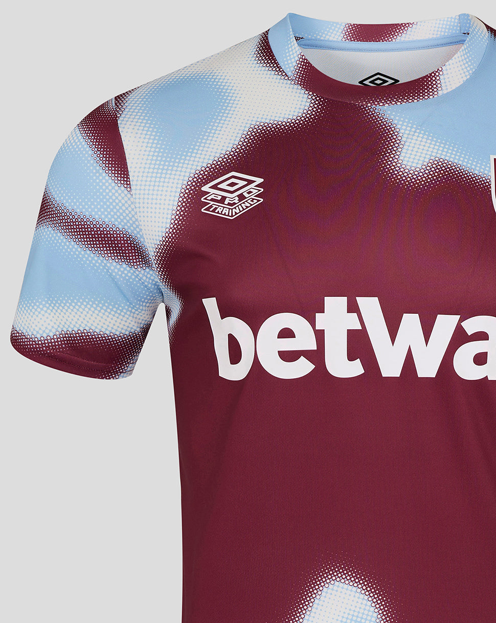 Close up of burgundy West Ham warm up jersey chest showing Umbro logo and bold betway text.