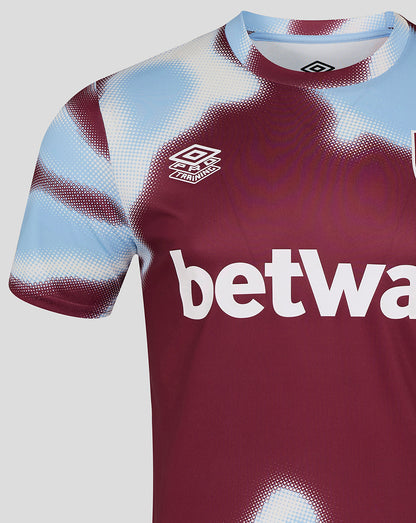 Close up of burgundy West Ham warm up jersey chest showing Umbro logo and bold betway text.