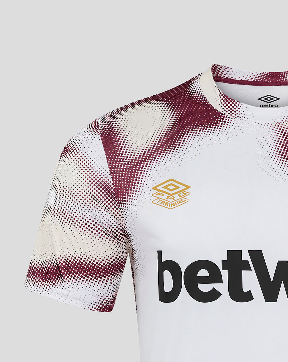 Shoulder and sleeve detail of West Ham 24/25 White Warm Up Jersey with burgundy dotted pattern on white fabric