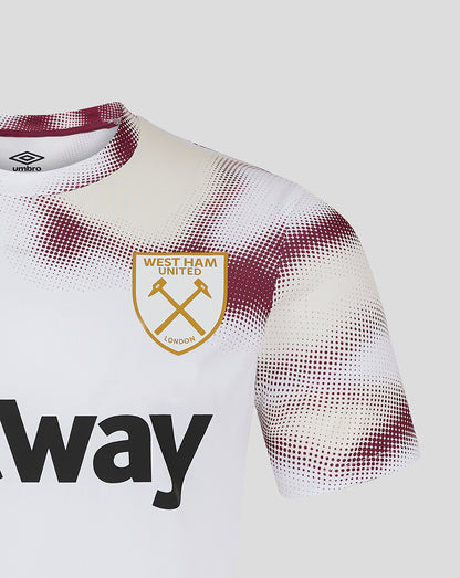 Close up of upper chest on West Ham 24/25 White Warm Up Jersey showing crest and Umbro logo with burgundy dotted pattern