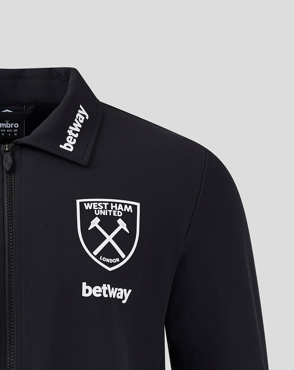 Close-up of chest area showing West Ham crest and Betway logo with collar branding on black jacket