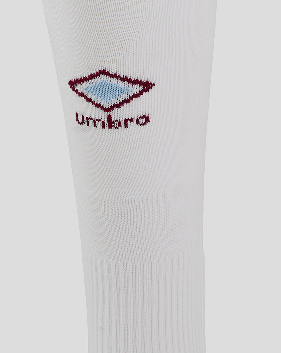 White sock close-up showing maroon Umbro diamond logo with light blue center
