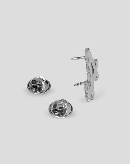 Back view of the silver BWT Alpine Formula One Team pin badge showing two posts and butterfly clasps