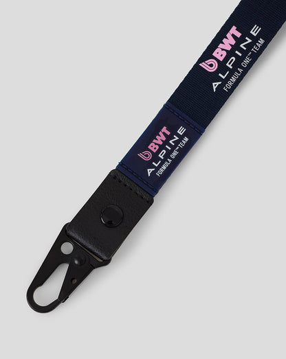 Close up of navy BWT Alpine Formula One Team lanyard showing logo panels and black metal clip.