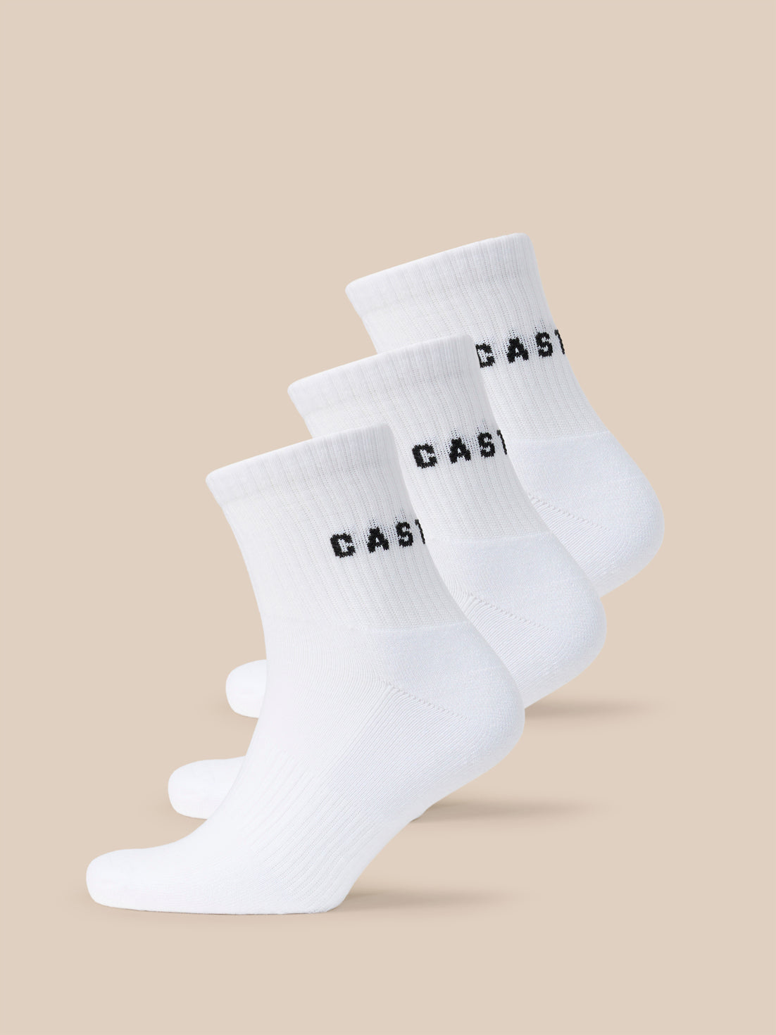 Three white quarter socks with black CASTORE logo across the cuff