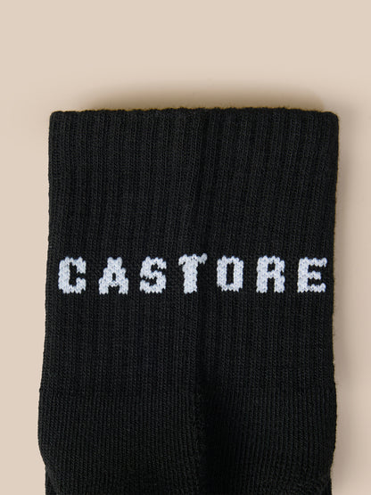 Close-up of three black quarter socks showing the CASTORE logo on the cuff