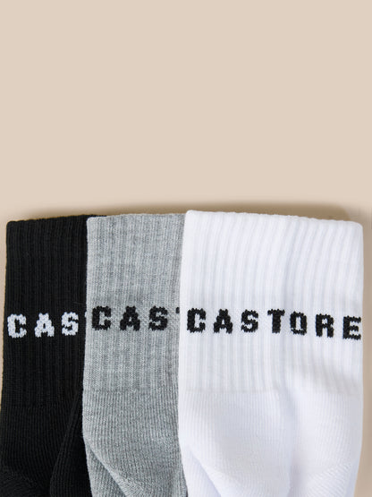 Three pack of Castore Druce quarter socks in black gray and white with bold Castore lettering