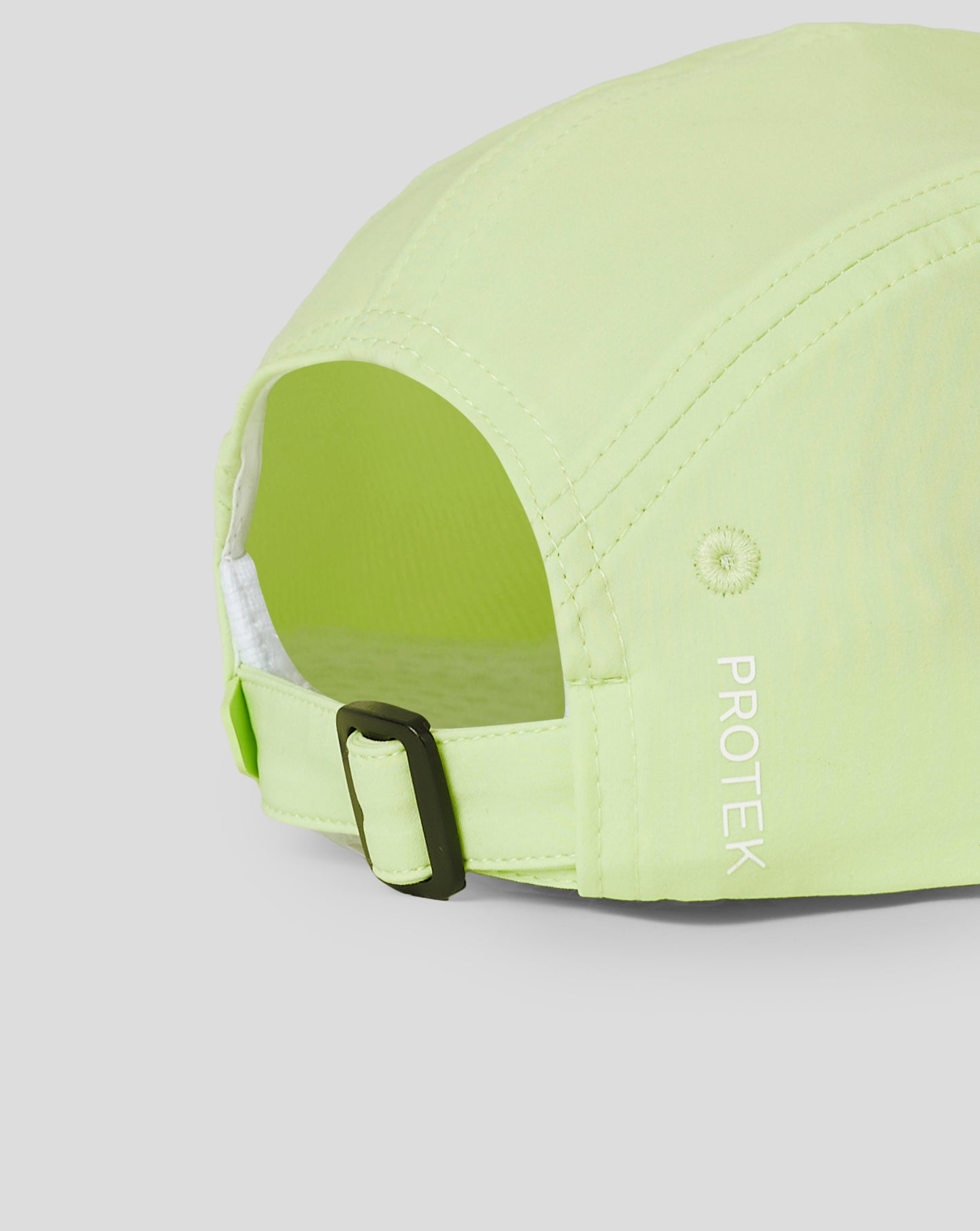 Side view of lime Reiss Performance Cap highlighting adjustable strap and buckle