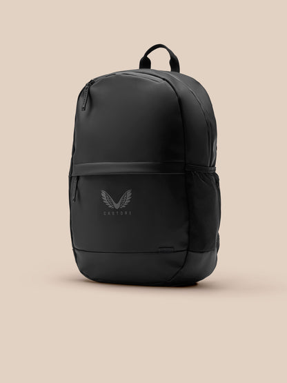 Core Backpack in black with padded back, adjustable shoulder straps, front zip pocket and Castore logo
