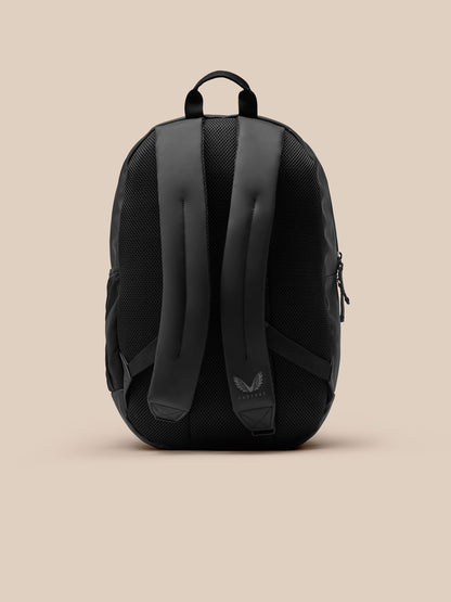 Core Backpack back view in black showing padded straps and Castore logo