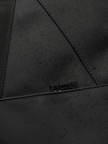 Close up of black ProTek water resistant fabric with droplets on a holdall panel