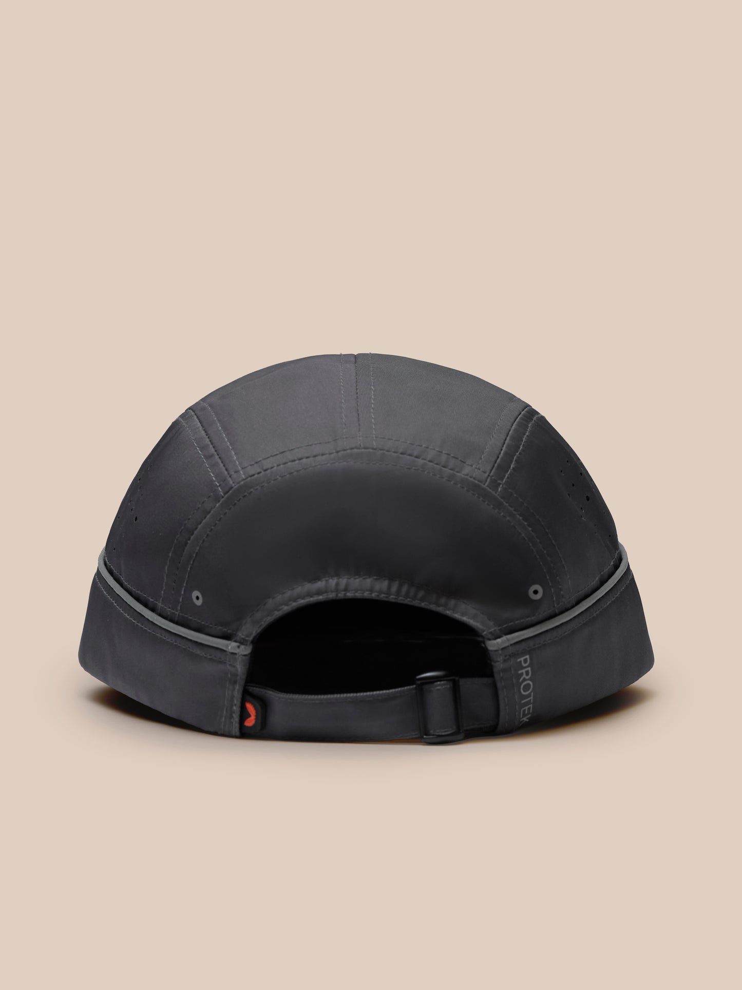 Back view of gunmetal unisex Elevated Cap with adjustable strap and buckle on beige background