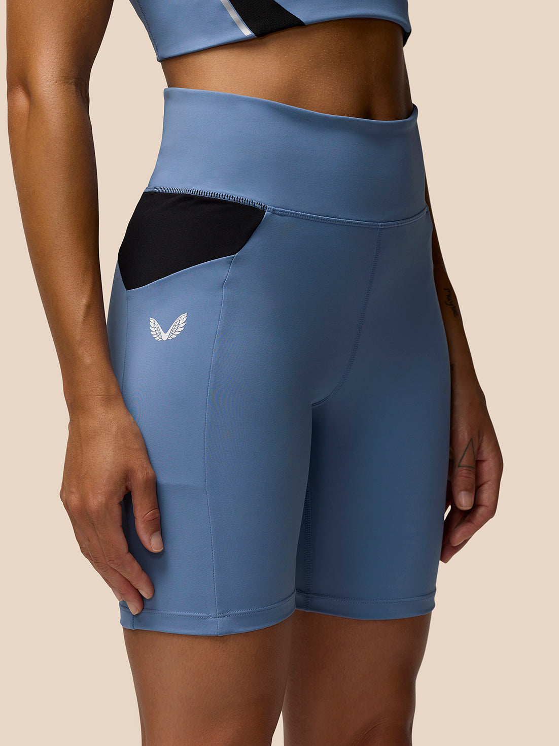 Apex Training Cycle Shorts in Dove Blue with black mesh side panels and a white Castore logo on the left leg
