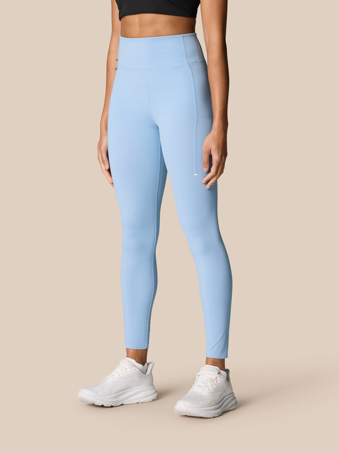 Zone Training Leggings sky blue worn from the back by a model, high waistband with Castore branding