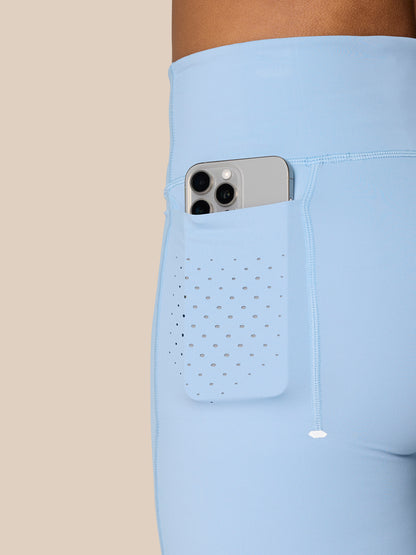 Hip area of Sky Blue Zone Training Leggings with perforated pocket panel and subtle seam lines.